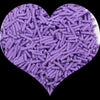 A heart shape filled with purple soft polymer clay candy sprinkles for cake decorating