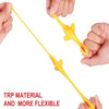 A hand is holding a yellow, flexible rubber chicken slingshot fidget toy.