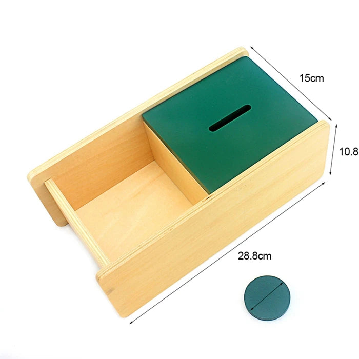 A wooden sensory toy set featuring a light wood box and a dark green lid, shown at an angle with dimensions.