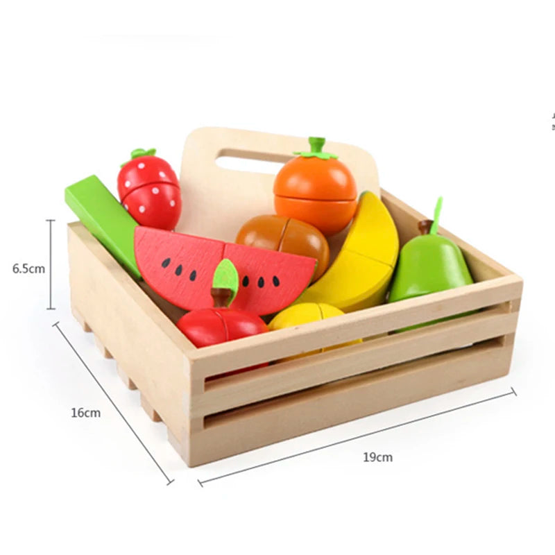 A wooden magnetic fruit and vegetable cutting play set featuring various colorful fruits like tomatoes, cucumbers, and melons