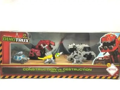 A box of Dinotrux dinosaur truck toys featuring removable dinosaur figures and a construction vs destruction theme.