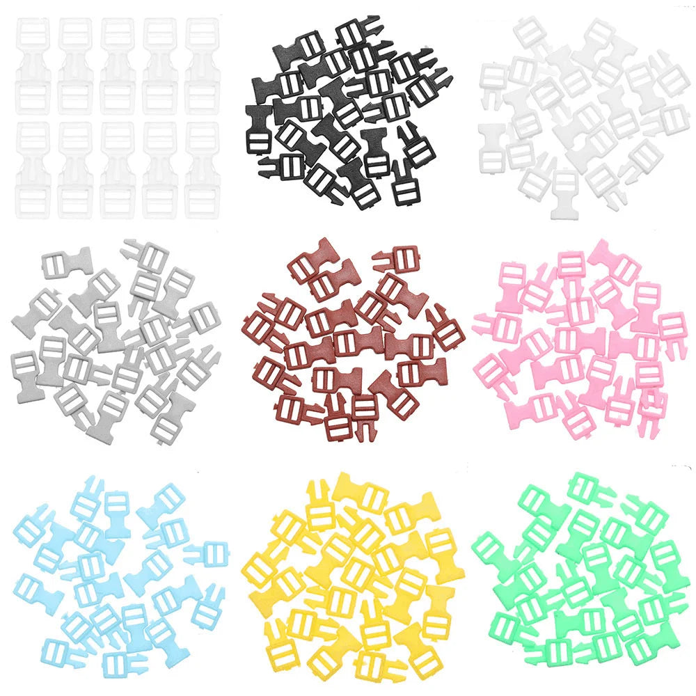 A collection of ten mini plastic buckles in various colors including black, white, pink, and green.