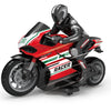 A red and black racing motorcycle model with a rider in full gear is shown in a dynamic pose.