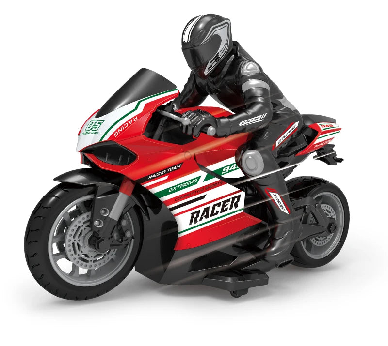 A red and black racing motorcycle model with a rider in full gear is shown in a dynamic pose.