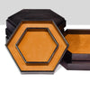 A set of two hexagonal dice trays or storage boxes with a matte gold interior and dark brown exterior.