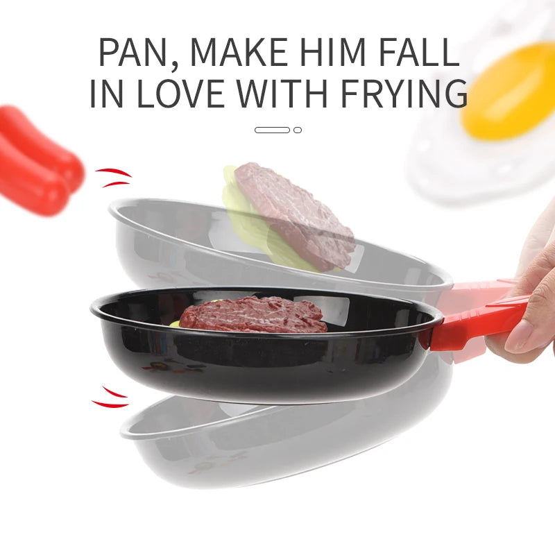 A red silicone food toy is shown next to a black frying pan and serving dishes for pretend play.