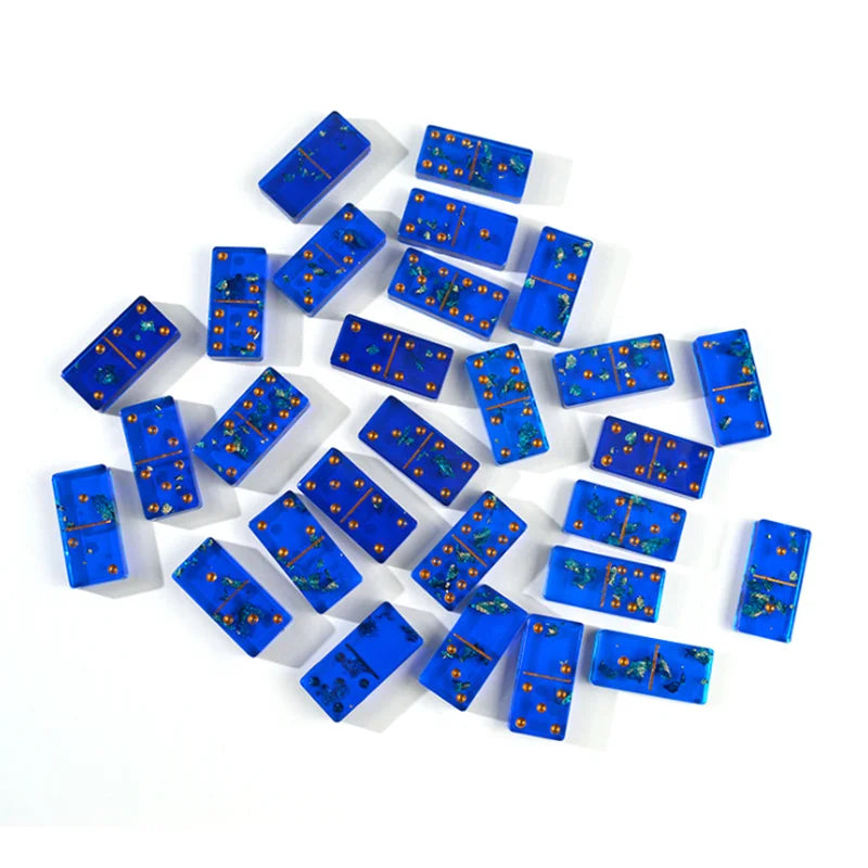 A collection of small blue domino tiles arranged in a pyramid shape.