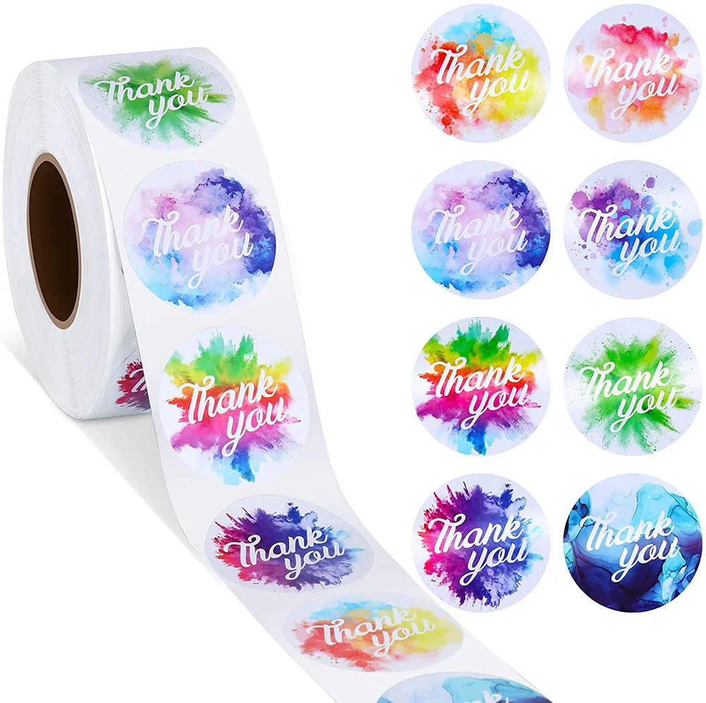 Roll of colorful round thank you stickers in various shades of pink, purple, blue, and green