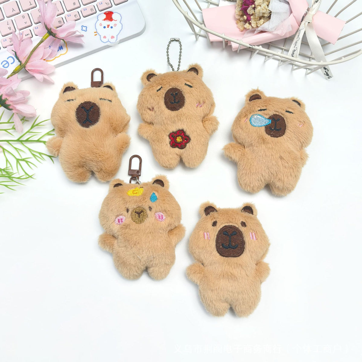 Five adorable brown teddy bear plush keychains with various facial expressions and accessories
