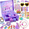 A purple advent calendar box filled with various mermaid-themed jewelry, including necklaces, earrings, and bracelets.