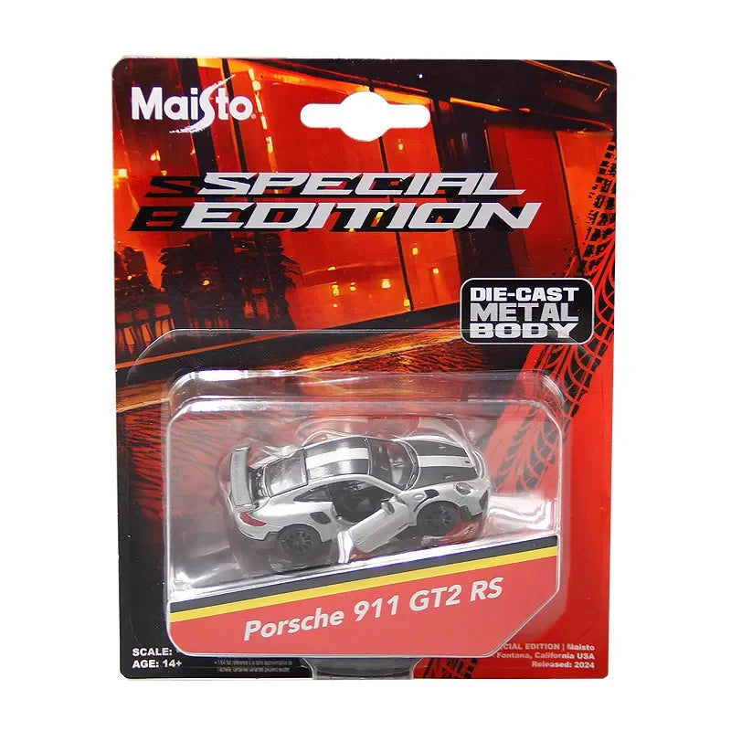 Diecast model of a Porsche 911 GT2 RS in silver and black colors displayed in its packaging.