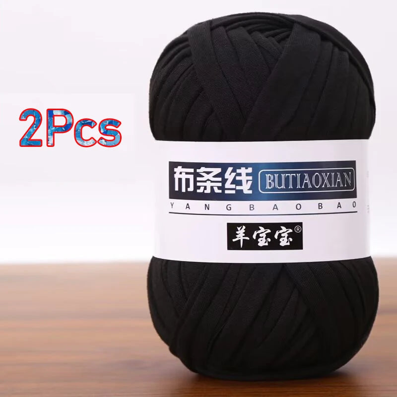 A black ball of soft chunky t-shirt yarn for crochet and knitting, packaged as a 2-pack.