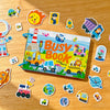 A colorful busy book for toddlers featuring various activity cards and toys on a wooden surface.