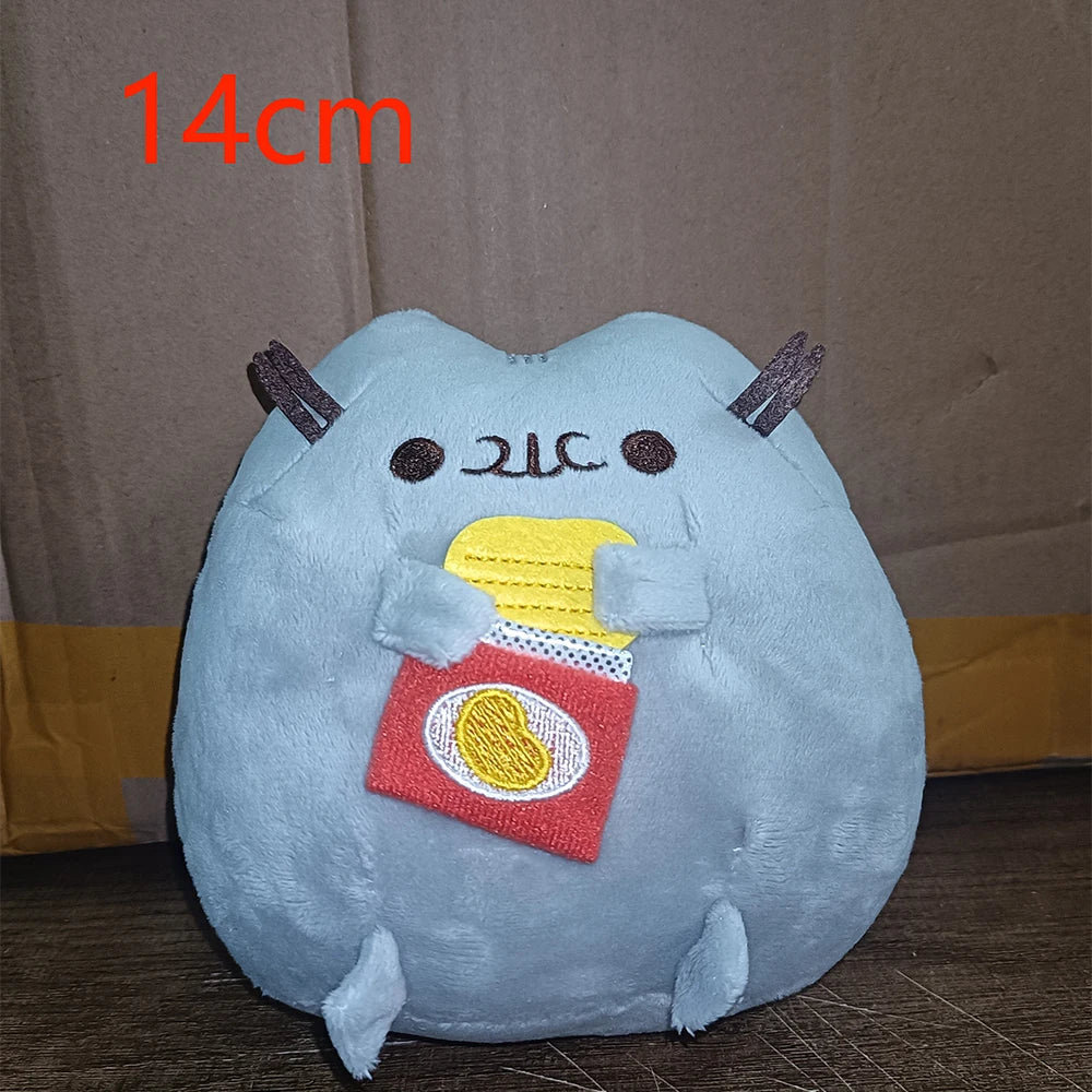 A light blue anime-inspired plush cat doll with horns and a yellow food item attached.