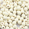 A close-up view of small, natural wooden beads in various off-white and cream colors.