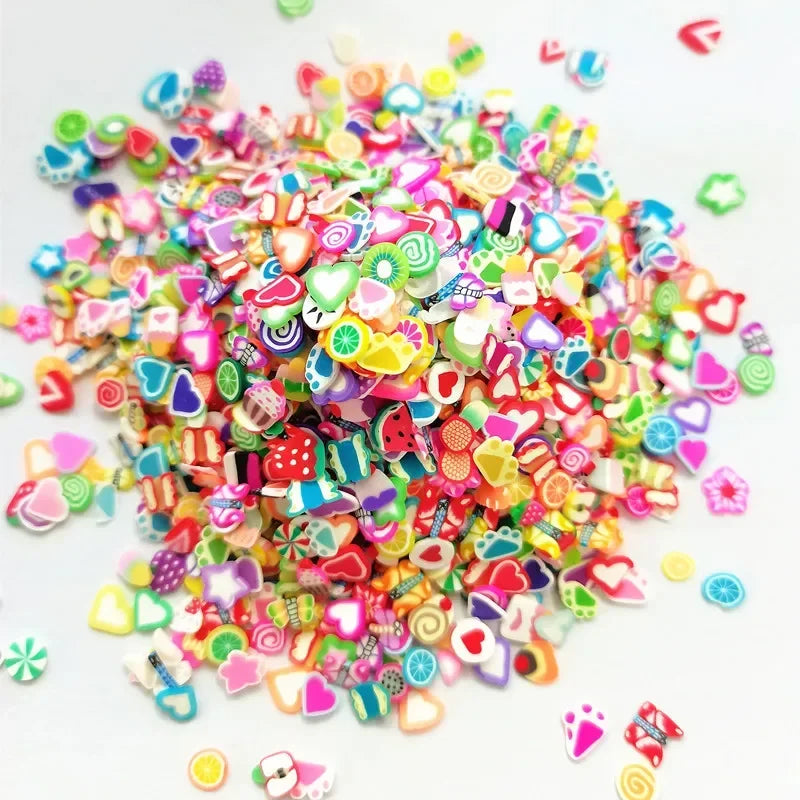 A pile of colorful polymer clay sprinkles in various shapes and colors for slime and craft decoration