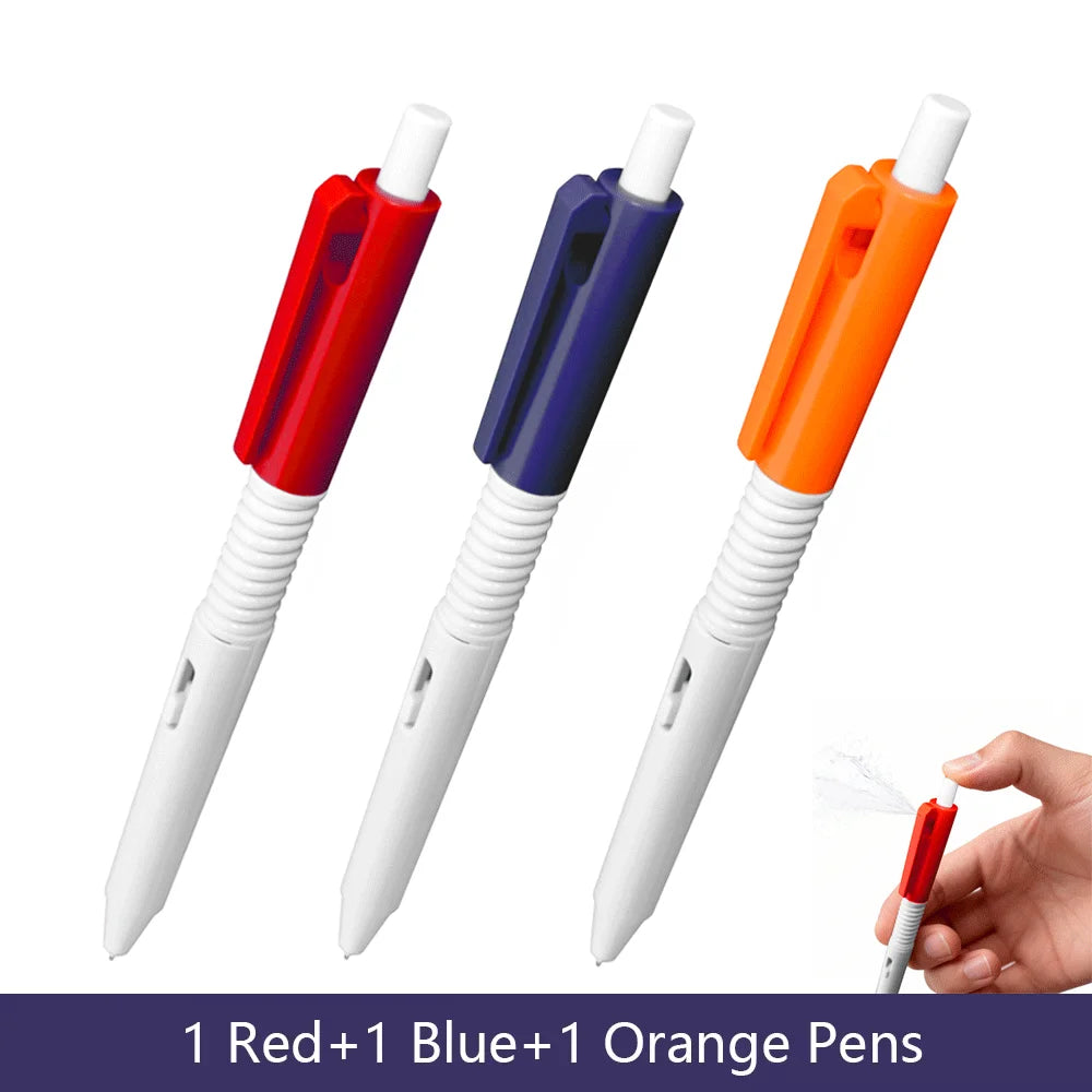 Three squirt water spray ballpoint pens in red blue and orange colors