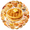 A circular arrangement of various food-themed stickers, including waffles, bread, and pastries.