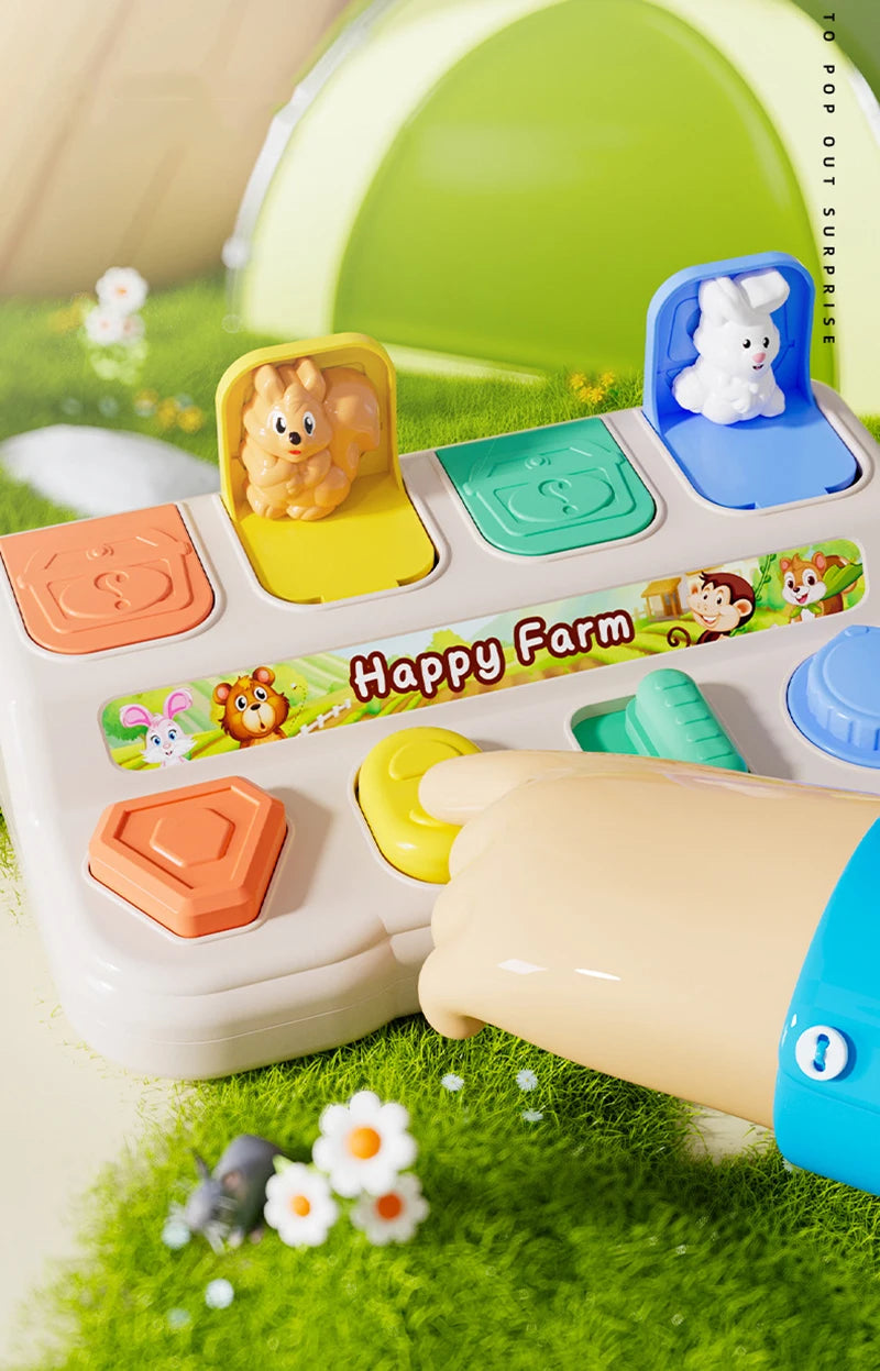 A Montessori pop-up animal toy featuring a yellow farm scene with animals and a blue hide-and-seek figure.