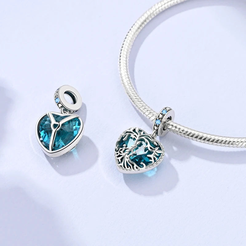 Sterling silver heart charm beads for bracelets featuring a blue gemstone design