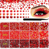 A collection of flatback resin rhinestones in various shades of red and gold for DIY crafts.