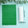 A green floral texture roller is shown next to a roll of white material on a light blue background.