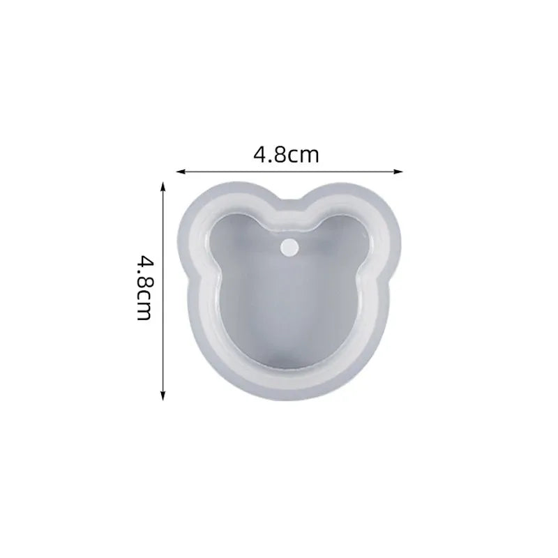 A light gray heart-shaped silicone mold for resin jewelry making, measuring 4.8cm by 4.8cm.