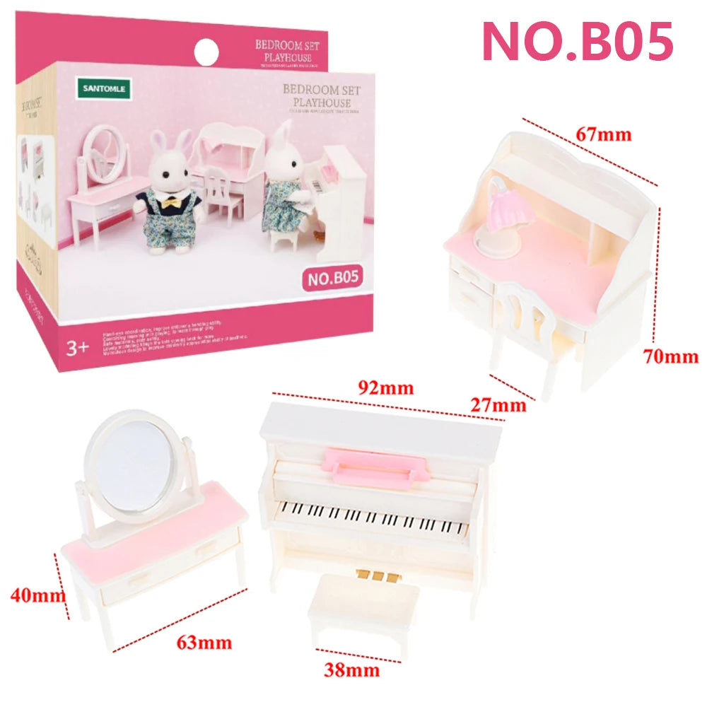 A pink and white bedroom set dollhouse furniture kit with a mirror, bed, and dresser.