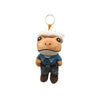 A cute plush frog doll with white fur, blue shirt, and dark pants, hanging from a gold loop.