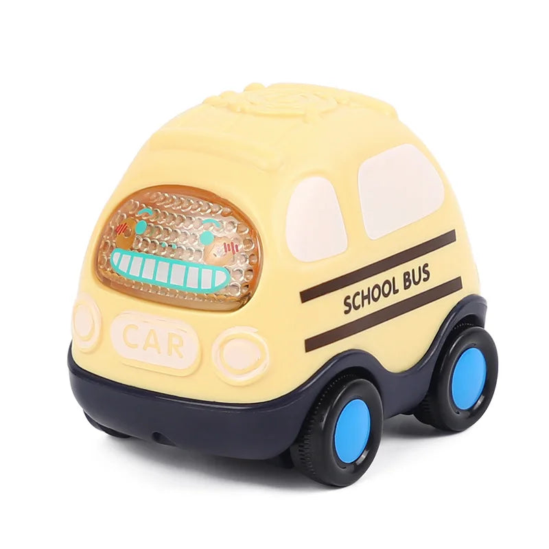 A yellow soft rubber push and go friction car toy for babies with a rattle feature.