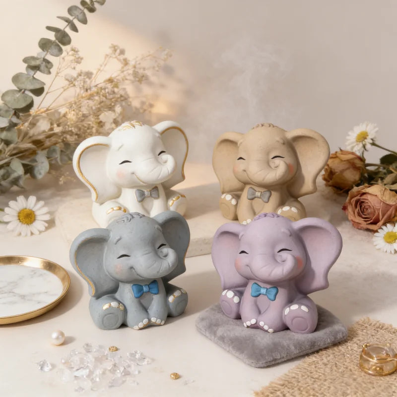 Three small elephant silicone molds in various shades of gray and lavender used for crafting.