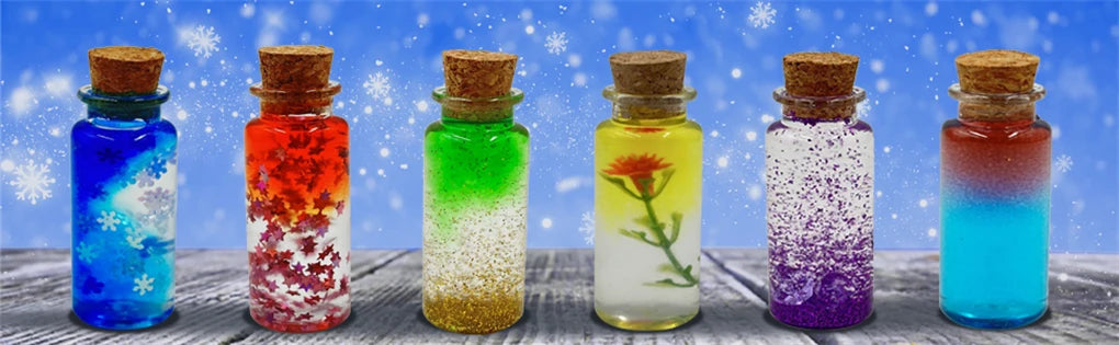Une rangée de six bouteilles en verre remplies de liquides colorés, suggérant un kit de création de potion féérique DIY.