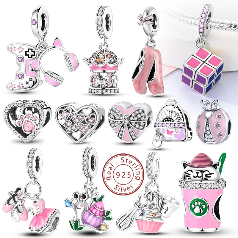 A collection of 925 sterling silver heart charm beads and animal charms in pink and silver tones.