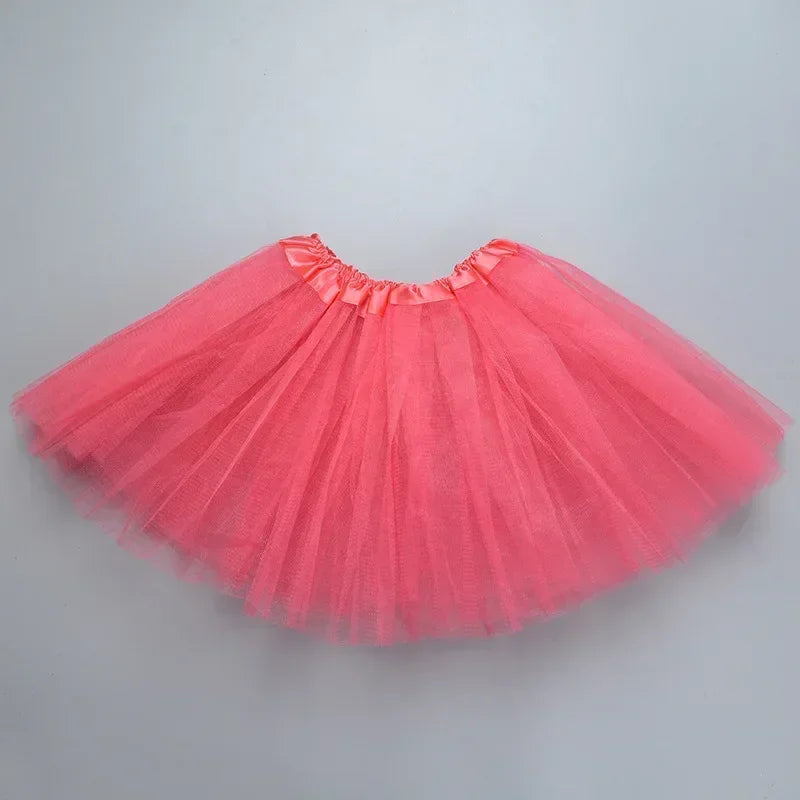 A bright pink three-layer tutu skirt for girls displayed against a light gray background.