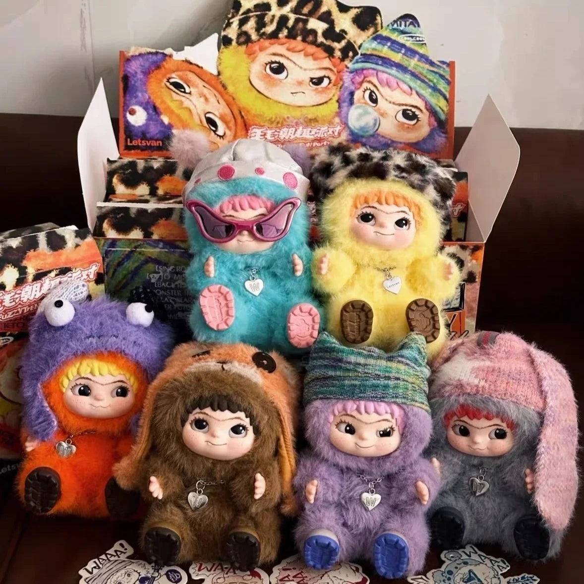 A collection of cute plush toys and collectible charms featuring various animal faces and colorful designs.