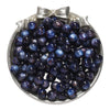 A pile of dark blue glitter cat eye resin beads in a silver-toned dish for jewelry making