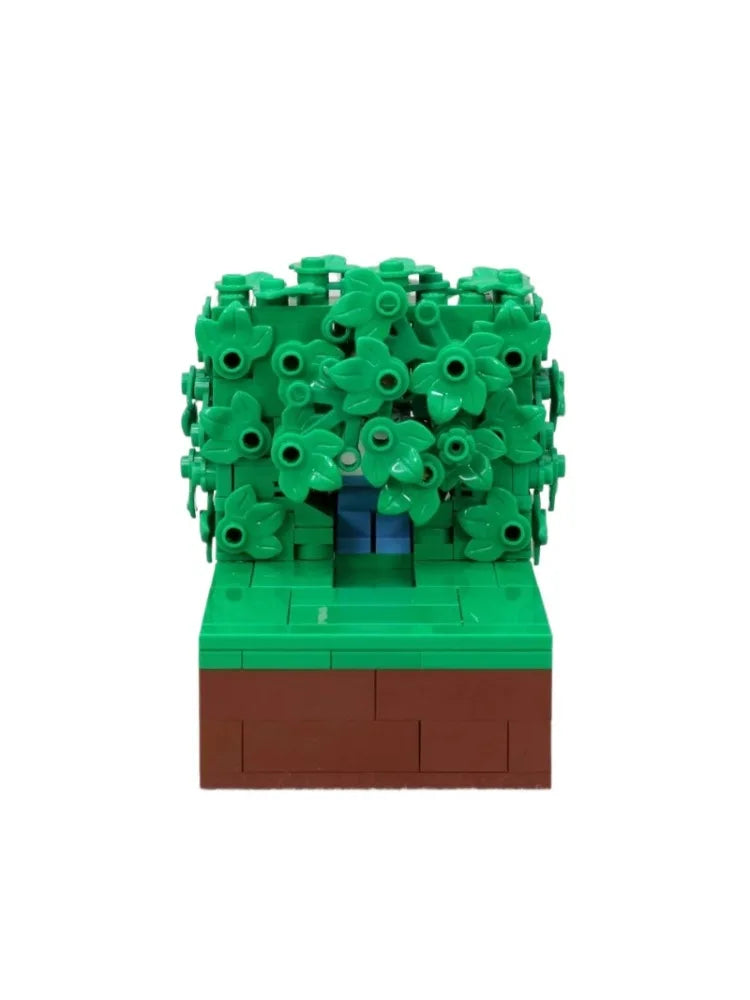 A LEGO building block model depicting Homer in the bushes scene with green foliage and a brown base.