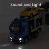 A blue Mercedes truck is driving a yellow race car on a diecast container truck with pull-back action and sound and light eff