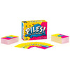 A box of piles folding card game with colorful cards and packaging