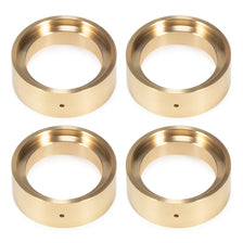 Four brass beadlock rings used as wheel weights for 1/18 RC crawlers