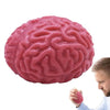 A pink, brain-shaped stress relief ball is being held by a man.