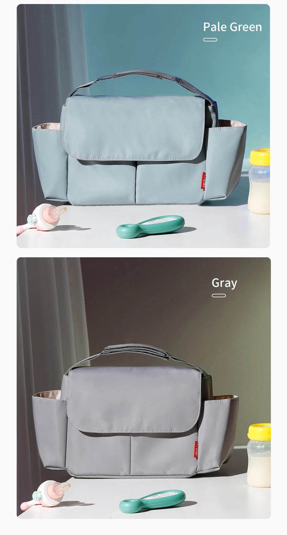 A light blue stroller organizer bag with a gray cupholder and a pink baby bottle shown against a soft green background.