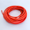A coil of flexible silicone tinned copper wire in bright orange color.