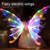 Pair of glowing fairy electric wings attached to a dress for a costume or display.