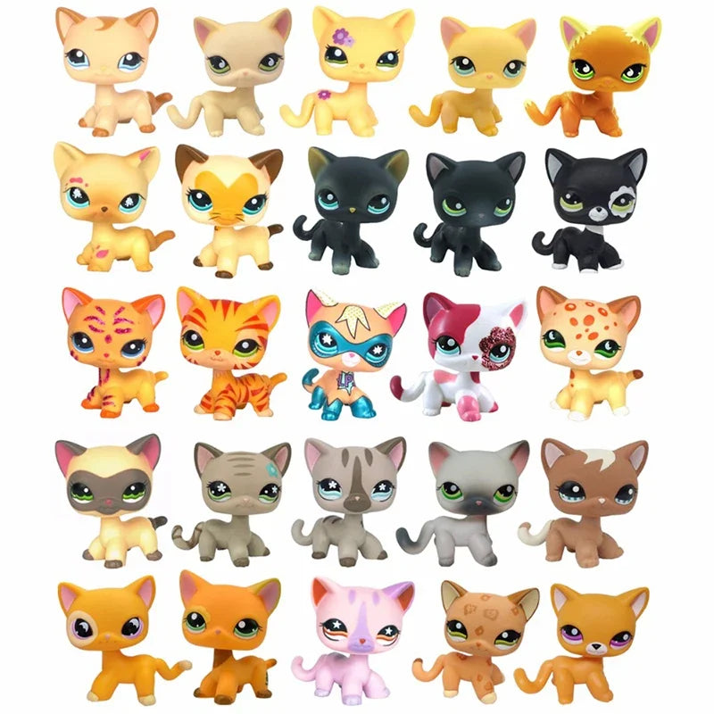 A collection of various Littlest Pet Shop style standing dog figures in different colors and patterns.