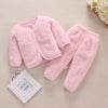 Pink fleece jacket and pants set for a baby, featuring a cartoon print.