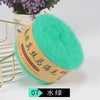 A ball of bright turquoise silk mohair blended yarn is displayed next to a gold wire rack.