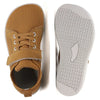 A pair of tan minimalist barefoot sneakers shown from the top and bottom views.