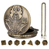 A bronze Steampunk dragon pocket watch dice case with seven small dice.
