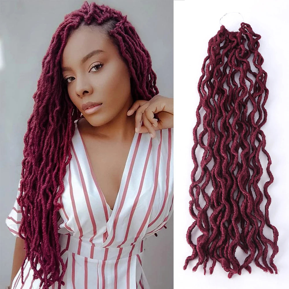 A woman models long, reddish-purple faux loc crochet hair extensions with a curly ombre texture.